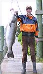 Chris Salp, of Alexandria, VA, set a new Maryland Atlantic Coast Division striper record last weekend when he caught this 52 1/2 lb. beauty while surf fishing at Assateague Island. Salp was using a bu