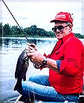Marylander Norman Bartlett with a nice smallmouth caught on Maine's Penobscot River. Circa 1982.
