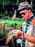 Bob Blatchley with a smallmouth bass caught in the upper Gunpowder River in Maryland. Circa 1980.