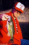 Fishing buddy Bob Blatchley shows off a nice Fontana Lake (North Carolina) smallmouth bass. Image circa 1970.