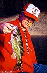 Fishing buddy Bob Blatchley shows off a nice Fontana Lake (North Carolina) smallmouth bass. Image circa 1970.