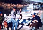 Marylander Tom Goodspeed and wife Phyliss return to dock at North Carolina's Fontana Lake with a stringer of smallmouth bass. Circa 1975.