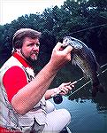 New Yorker Ray Kozara with a smallmouth bass caught on the Potomac River just below the Brunswick Bridge. Circa 1985.