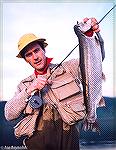 Joe Reynolds shows a nice rainbow trout caught on the Golgol River in southern Chile in mid 80s.