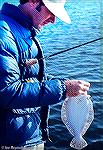 Joe Reynolds with an Ocean City, Maryland flounder. 1975ish.