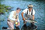 Joe Reynolds (left) and guide show an Atlantic Salmon caught from the York River. 2009.