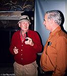 Artist Frank Smoot (left) and Marty Rouse converse at a gathering of fly fishemen in May 1983.