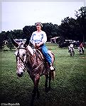Jeanette Reynolds rides a mule at a Pennsylvania Outdoors Writers Association meeting in July 1985.