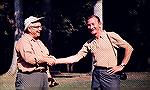 Leon Martuch (left), one of the founders of Scientific Anglers in Midland, Michigan, shakes hands with Leon Chandler, 51 years as vice-president and good-will ambassador of New York's Cortland Line Co
