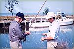 Chuck Edghill (left) and Bill Brighoff photographed at Brighoff's Sportsmans Chance Marina on the Chesapeake Bay's Little Choptank River. September 1968. Breaking striped bass were everywhere.