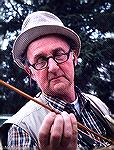 Long-time Maryland Fly Anglers member Charlie Ports rigs up for some trout fishing. April 1982.