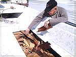 Chuck Edghill examines rotted/separating plywood deck of my cat-style hull fishing boat. Plan is to remove all the deck, fill each cat hull with foam, and then fiberglass in a new synthetic material d
