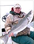 Bob Blatchley with a "keeper" striped bass caught in the bay at Ocean City, Maryland during December.