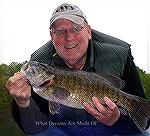 Brian Wilhelm shows a nice smallmouth bass caught and reelased at Liberty Reservoir in May 2013.